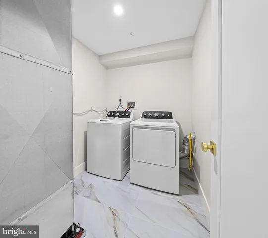a bathroom with a granite countertop sink a toilet and a mirror