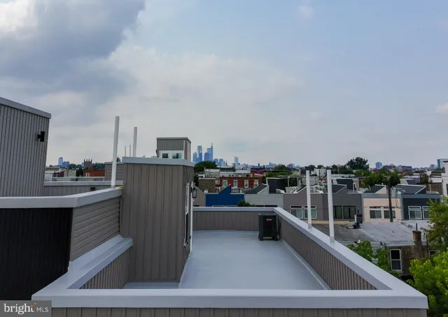a buildings covered with tall trees