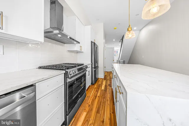 a spacious bathroom with a sink and a mirror