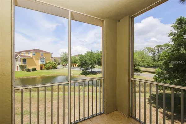 a view of a glass door and a yard