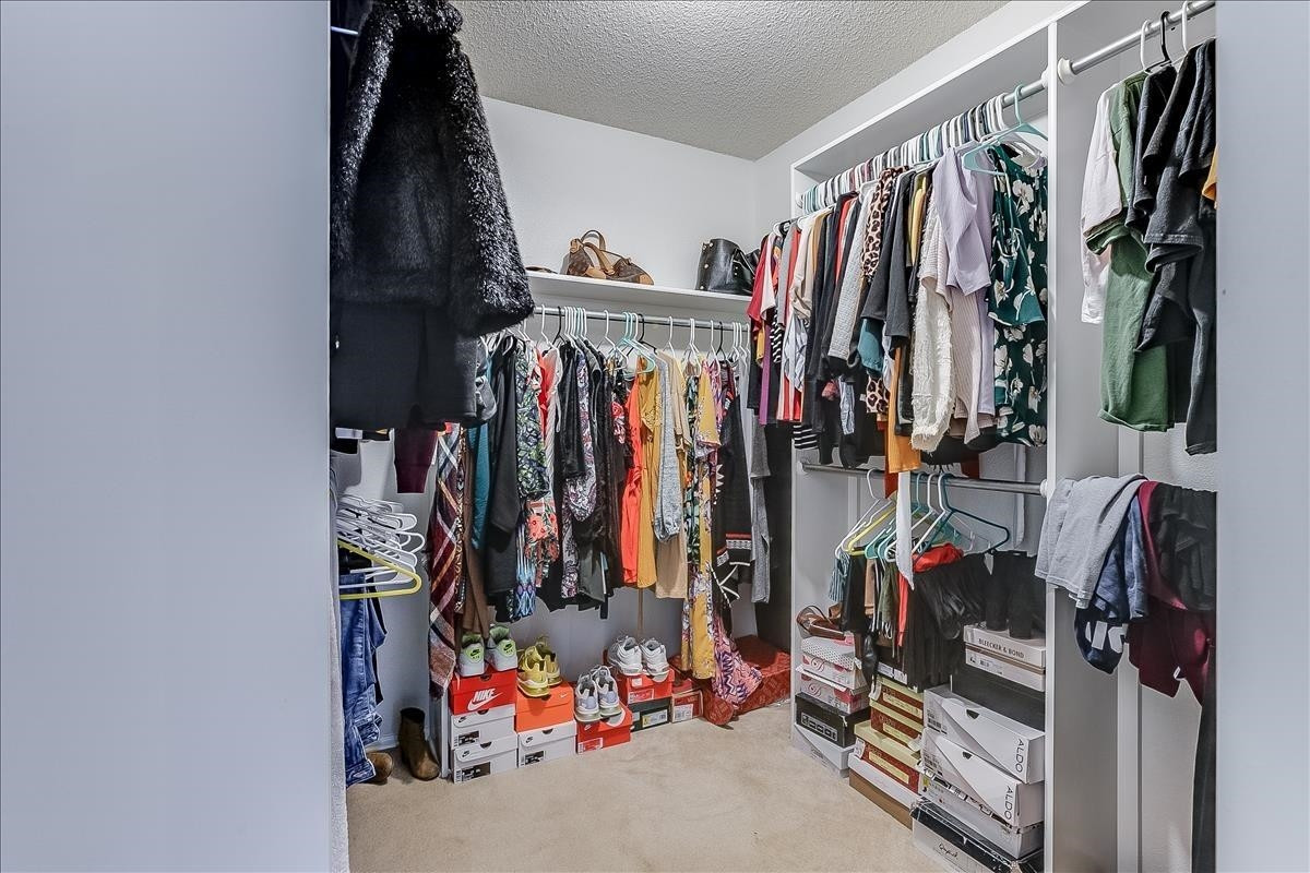 5307 69th Street Lubbock, TX 79424 - Photo 12 of 22 a view of walk in closet with clothes