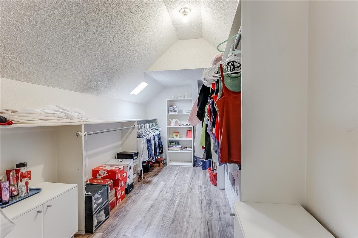 5307 69th Street Lubbock, TX 79424 - Photo 14 of 22 a view of a storage & utility room with clothes shoes washer and dryer