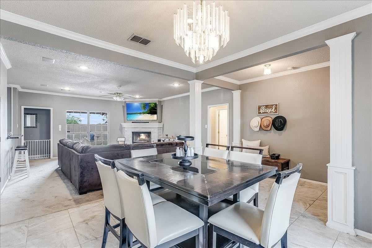 5307 69th Street Lubbock, TX 79424 - Photo 3 of 22 a view of a dining room with furniture and wooden floor