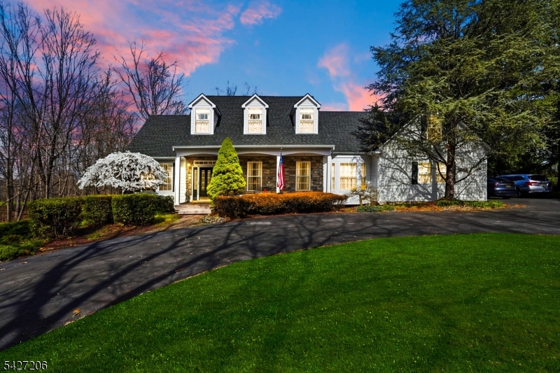 140 Bunker Hill Road Princeton, NJ 08540 - Photo 1 of 44 a front view of a house with a garden and trees