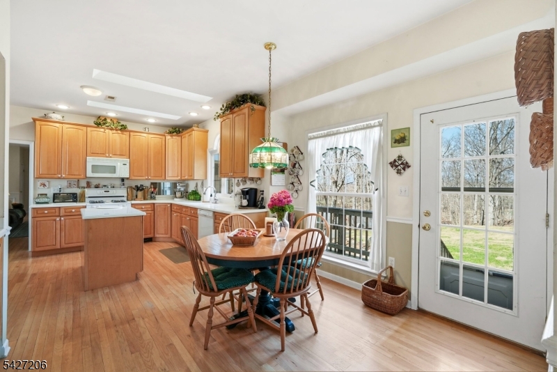140 Bunker Hill Road Princeton, NJ 08540 - Photo 11 of 44 a dining room with furniture a chandelier and wooden floor