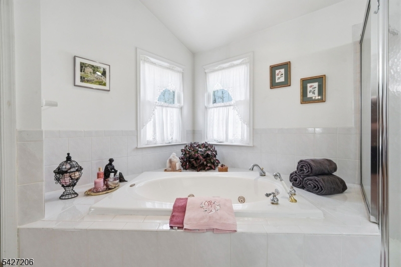140 Bunker Hill Road Princeton, NJ 08540 - Photo 22 of 44 a bathroom with a tub sink and mirror