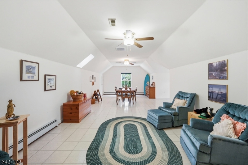 140 Bunker Hill Road Princeton, NJ 08540 - Photo 34 of 44 a view of a livingroom with furniture and a ceiling fan