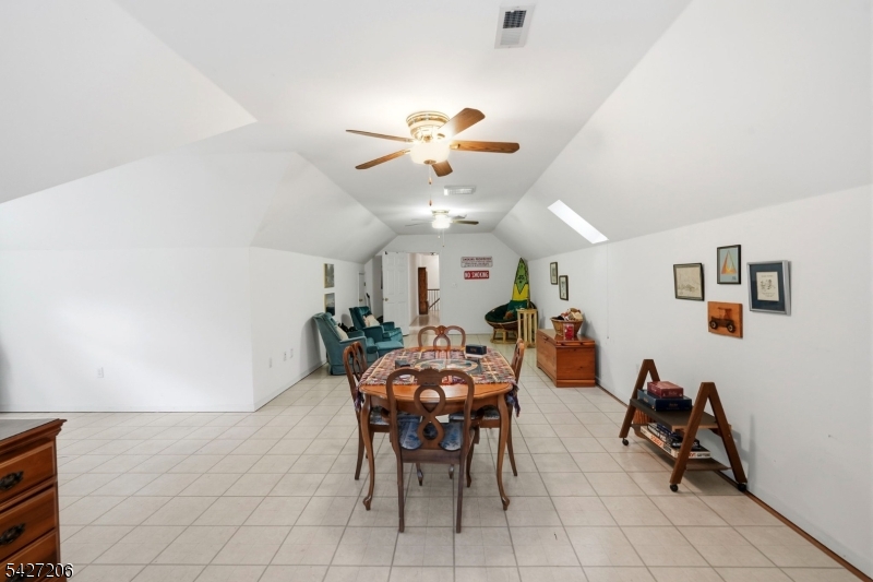 140 Bunker Hill Road Princeton, NJ 08540 - Photo 35 of 44 a view of a dining room and livingroom with furniture and a chandelier fan
