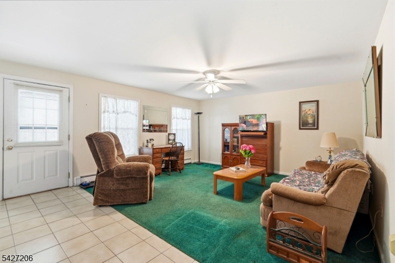 140 Bunker Hill Road Princeton, NJ 08540 - Photo 38 of 44 a living room with furniture and a large window