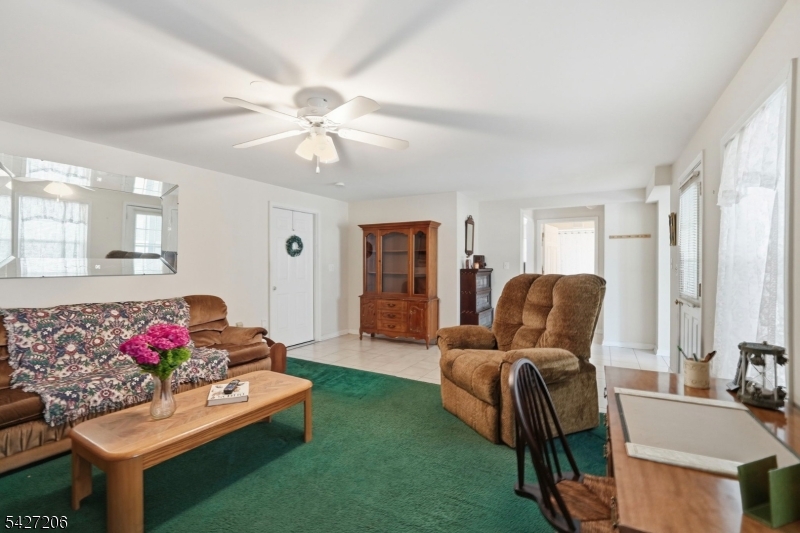 140 Bunker Hill Road Princeton, NJ 08540 - Photo 39 of 44 a living room with furniture and a chandelier