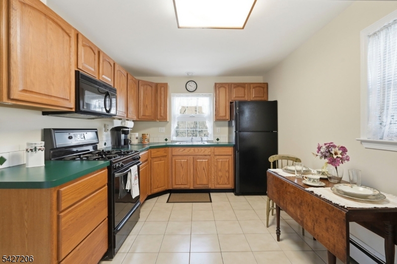 140 Bunker Hill Road Princeton, NJ 08540 - Photo 40 of 44 a kitchen with stainless steel appliances granite countertop a stove refrigerator sink and cabinets