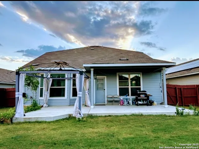 a view of a house with swimming pool and a yard