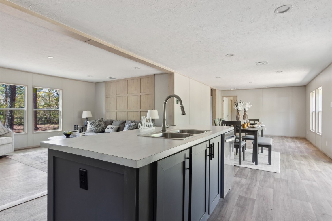54178 Bea Road Callahan, FL 32011 - Photo 19 of 36 a kitchen with a table chairs and wooden floor