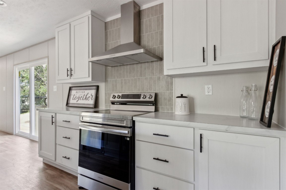 54178 Bea Road Callahan, FL 32011 - Photo 21 of 36 a kitchen with cabinets stainless steel appliances and a counter space