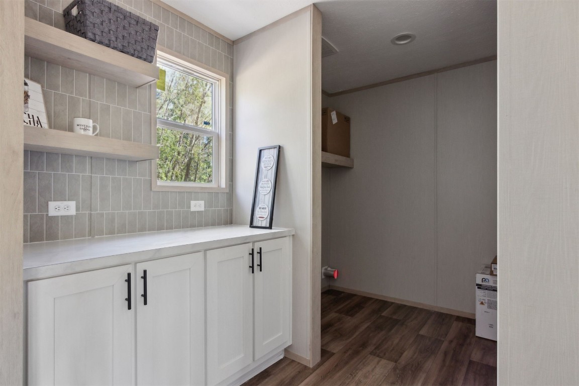 54178 Bea Road Callahan, FL 32011 - Photo 22 of 36 a view of cabinets with wooden floor and window