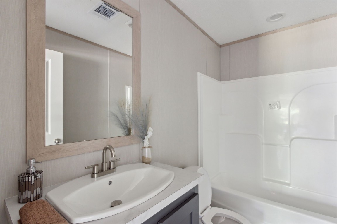 54178 Bea Road Callahan, FL 32011 - Photo 31 of 36 a bathroom with a sink and a mirror