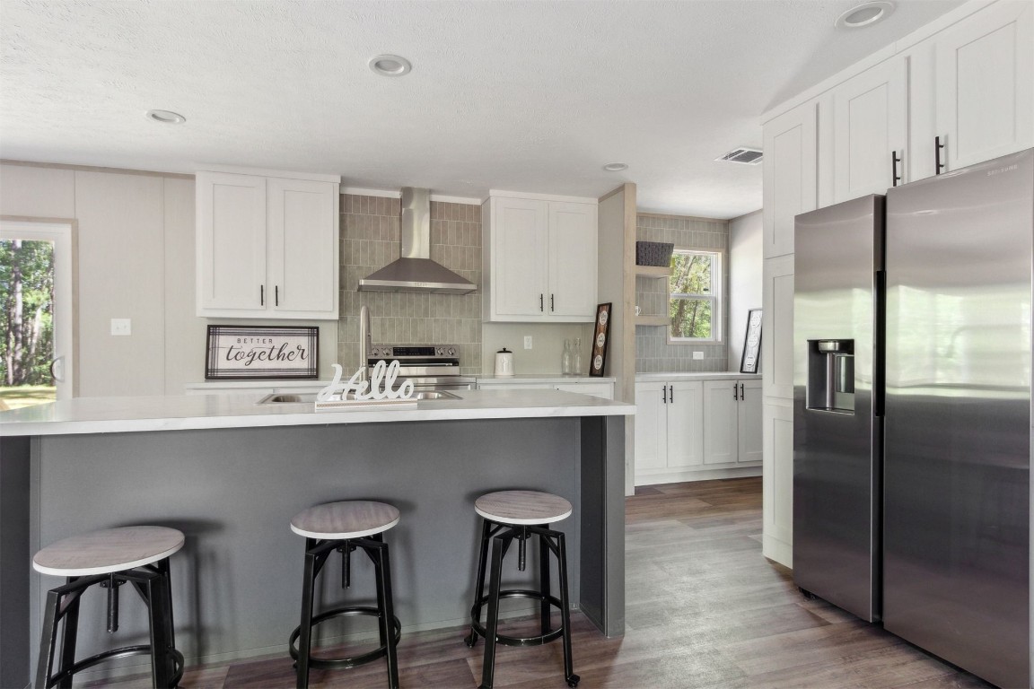 54178 Bea Road Callahan, FL 32011 - Photo 4 of 36 a kitchen with stainless steel appliances a sink stove and refrigerator