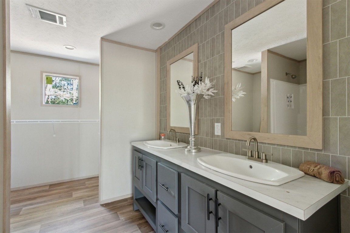 54178 Bea Road Callahan, FL 32011 - Photo 6 of 36 a bathroom with a sink and a mirror