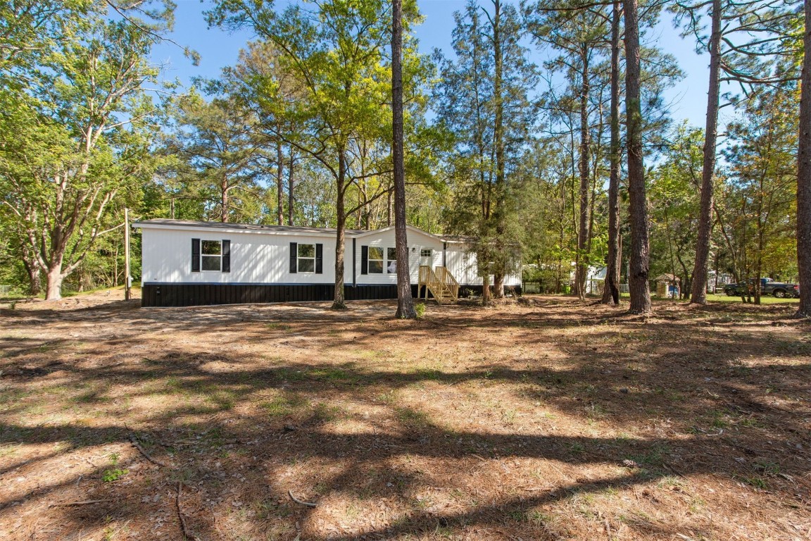 54178 Bea Road Callahan, FL 32011 - Photo 9 of 36 a backyard of a house with lots of green space