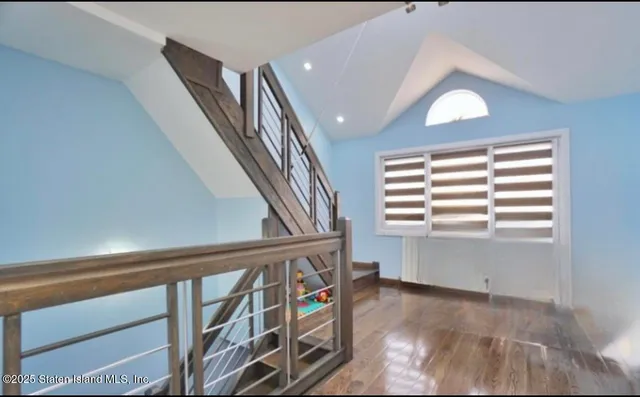a view of an entryway with wooden floor