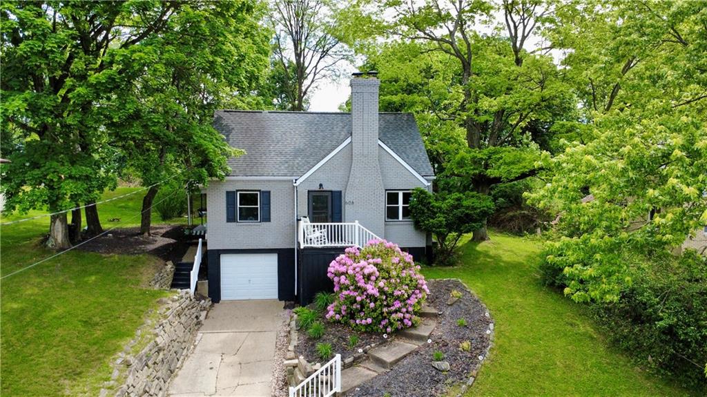 608 Wible Run Road Pittsburgh, PA 15209 - Photo 1 of 27 a front view of house with garden