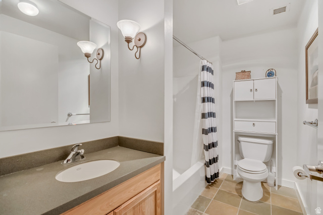 1364 Still Water Drive, Unit R3005 Heber City, UT 84032 - Photo 11 of 28 Bathroom with vanity, shower / bathtub combination with curtain, and light tile patterned floors