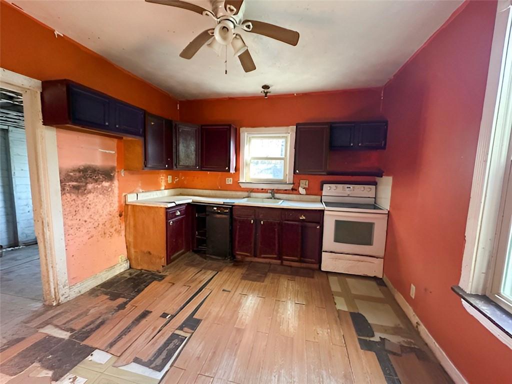 135 Church Street Washington, PA 15301 - Photo 6 of 11 a kitchen with stainless steel appliances a sink and a refrigerator