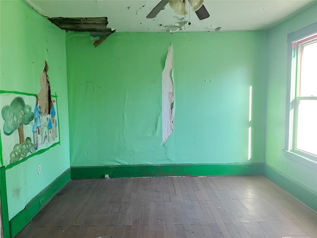 135 Church Street Washington, PA 15301 - Photo 9 of 11 a view of empty room with window and fan
