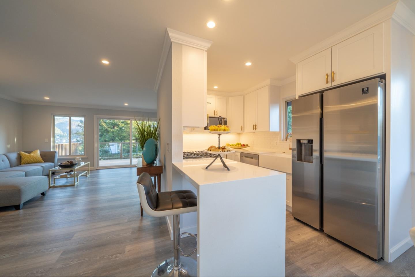 17 Point Reyes Way Pacifica, CA 94044 - Photo 8 of 65 a kitchen with counter top space a sink appliances and cabinets