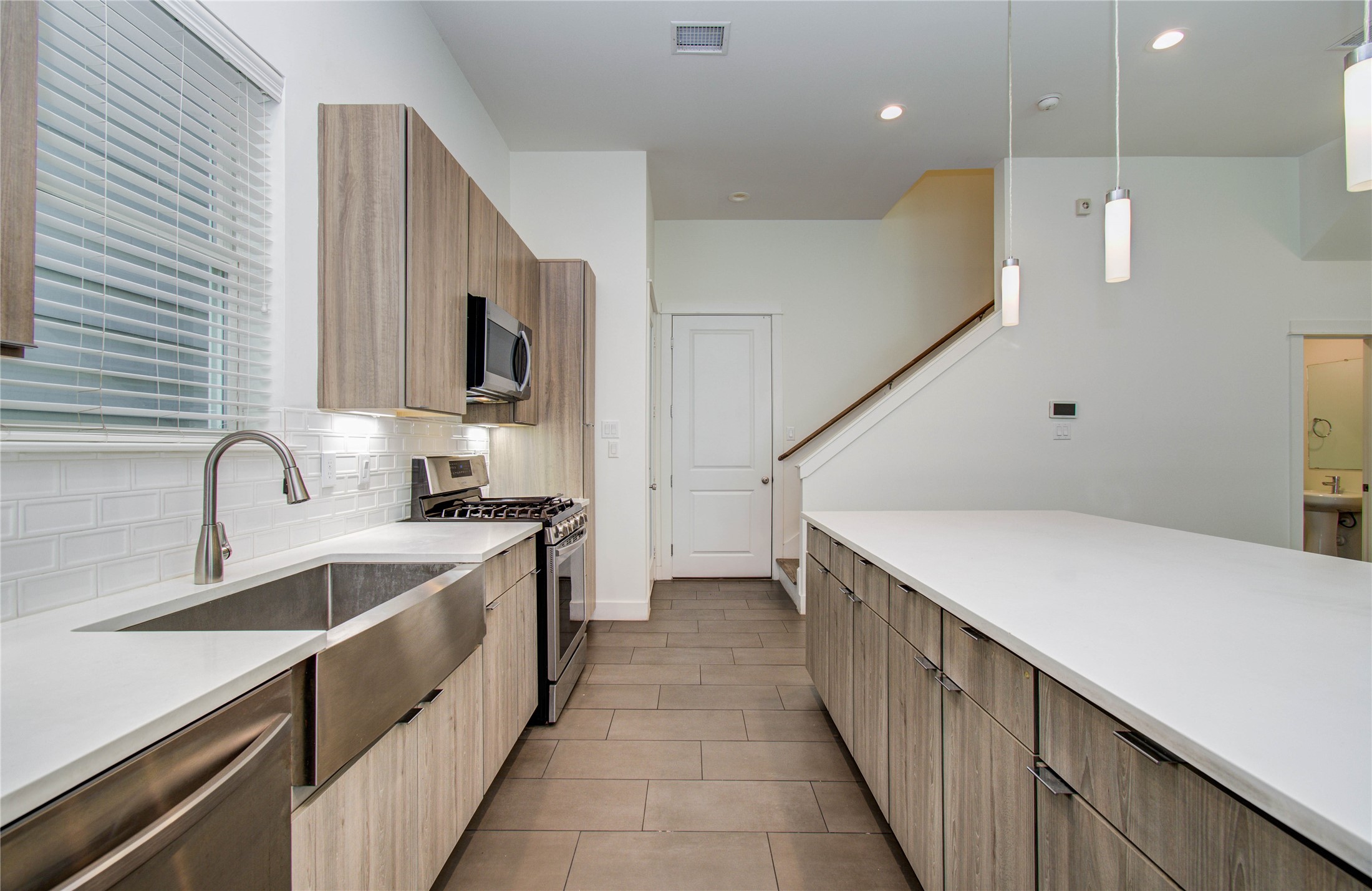 556 Janisch Road Houston, TX 77018 - Photo 11 of 29 a kitchen with a sink and cabinets