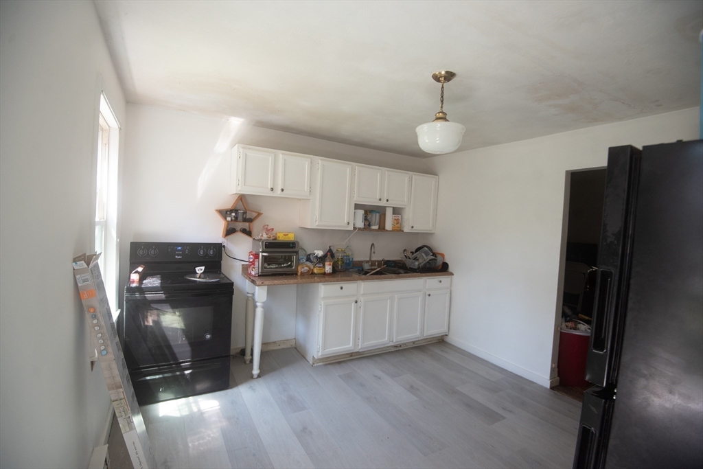 920 Worcester Road Barre, MA 01005 - Photo 34 of 40 a kitchen with granite countertop a refrigerator stove and sink