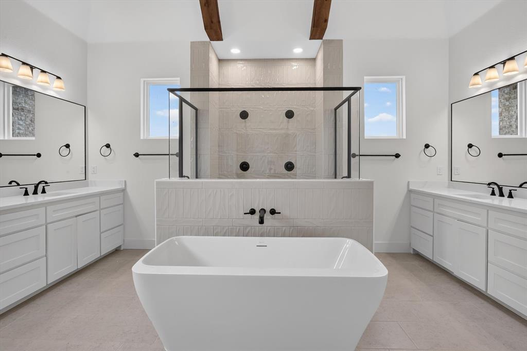 471 Red Bird Drive Springtown, TX 76082 - Photo 20 of 35 Freestanding soaking tub centered in a spacious bathroom