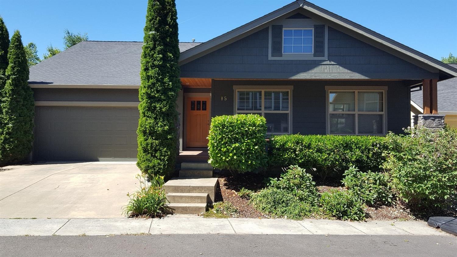 15 Logan Way Talent, OR 97540 - Photo 1 of 9 a front view of a house with garden