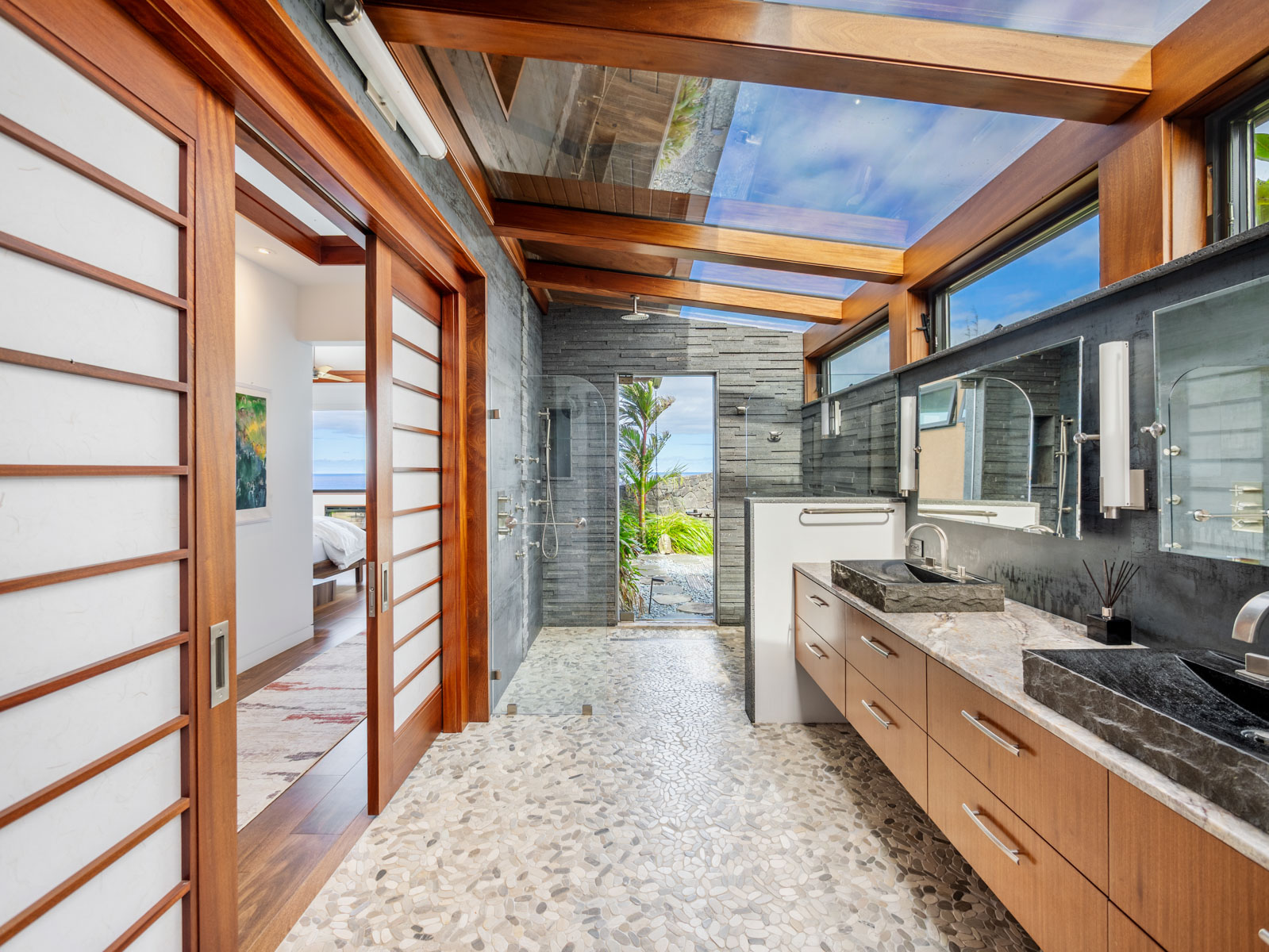 45-5038 Nānaina Kai Road Honokaa, HI 96727 - Photo 13 of 29 a large kitchen with stainless steel appliances granite countertop a sink and cabinets