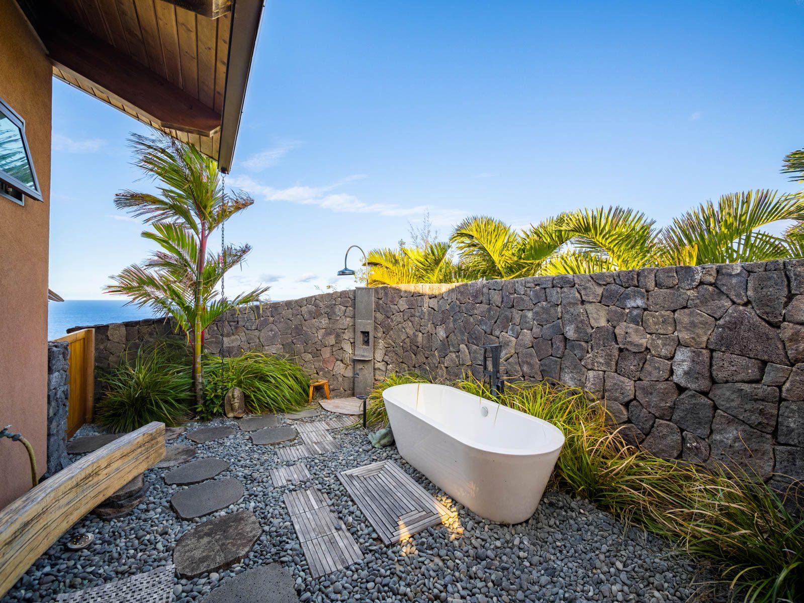 45-5038 Nānaina Kai Road Honokaa, HI 96727 - Photo 14 of 29 a bathroom with a toilet a sink and a mirror