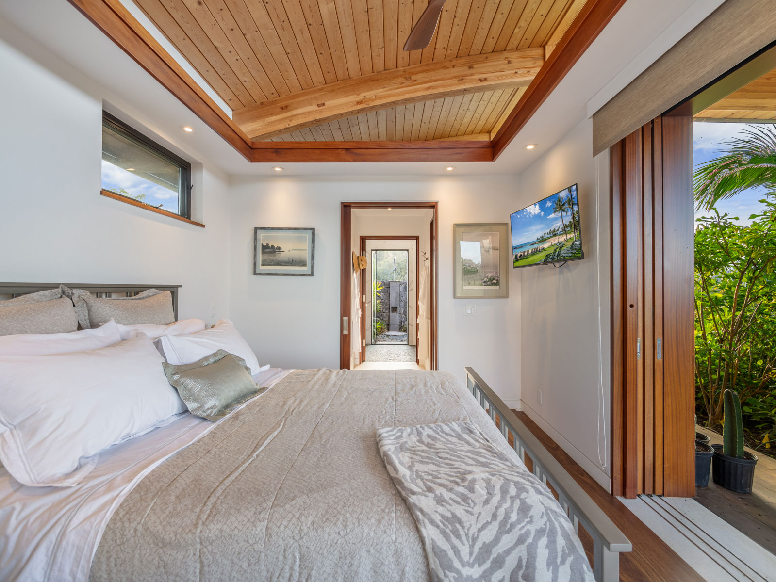 45-5038 Nānaina Kai Road Honokaa, HI 96727 - Photo 23 of 29 a bedroom with a bed and a window