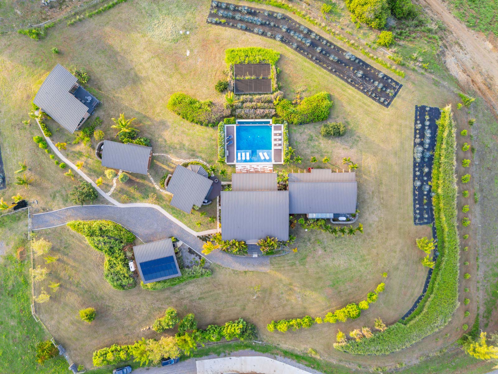 45-5038 Nānaina Kai Road Honokaa, HI 96727 - Photo 27 of 29 an aerial view of a house with a swimming pool