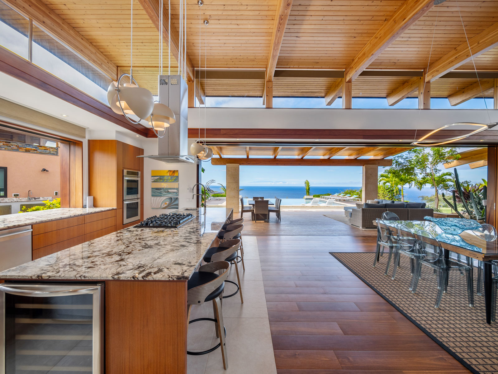 45-5038 Nānaina Kai Road Honokaa, HI 96727 - Photo 4 of 29 a view of a patio with dining table and chairs under an umbrella