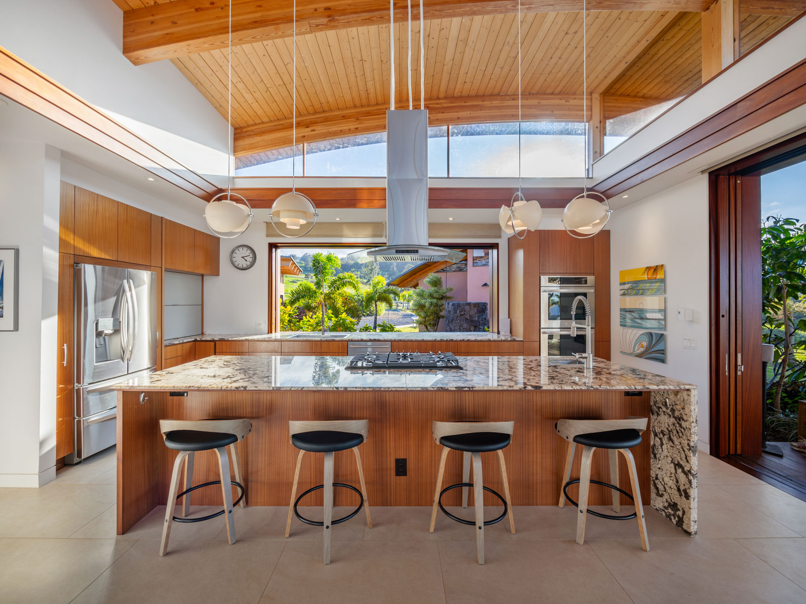 45-5038 Nānaina Kai Road Honokaa, HI 96727 - Photo 5 of 29 a dining table chairs in front of a building