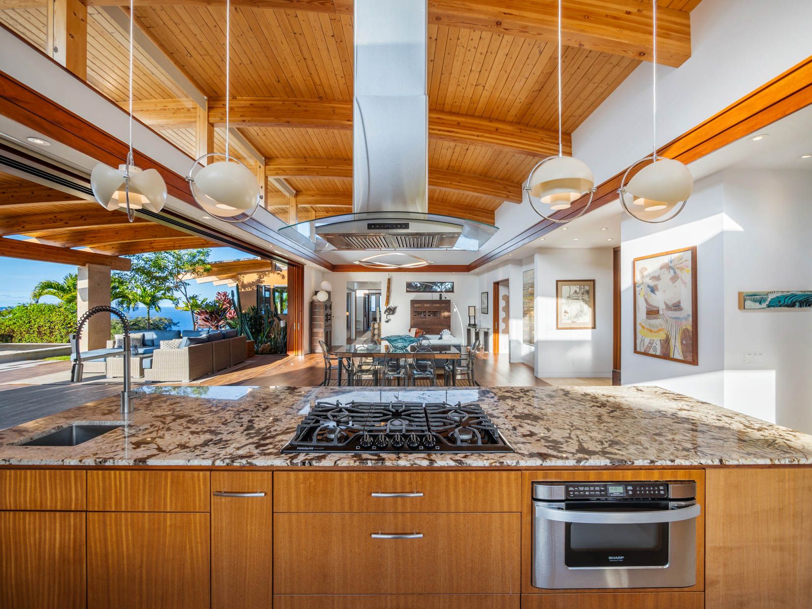 45-5038 Nānaina Kai Road Honokaa, HI 96727 - Photo 7 of 29 a kitchen with stainless steel appliances granite countertop a sink and a stove