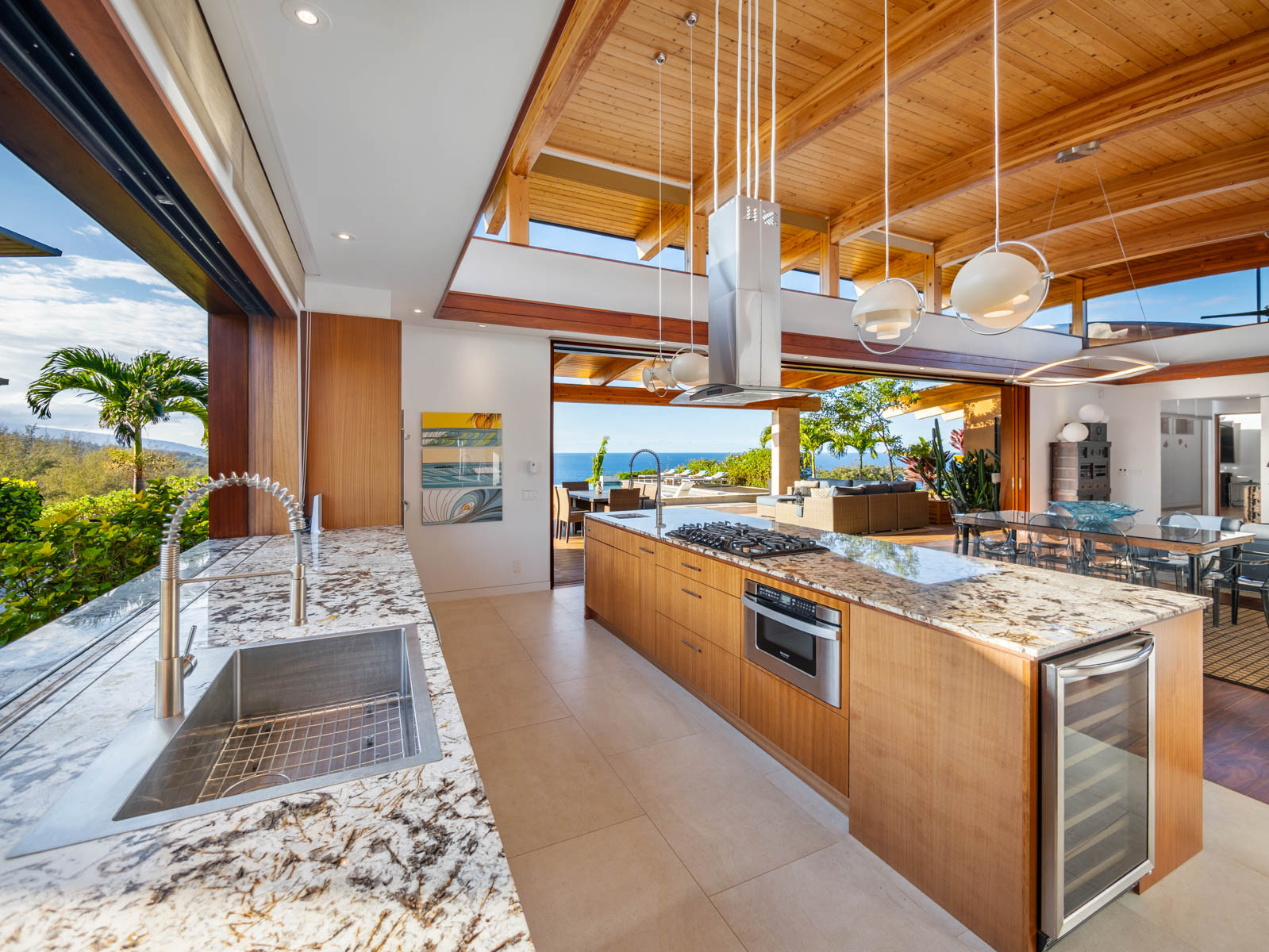 45-5038 Nānaina Kai Road Honokaa, HI 96727 - Photo 8 of 29 a kitchen with stainless steel appliances granite countertop a stove a sink and a microwave