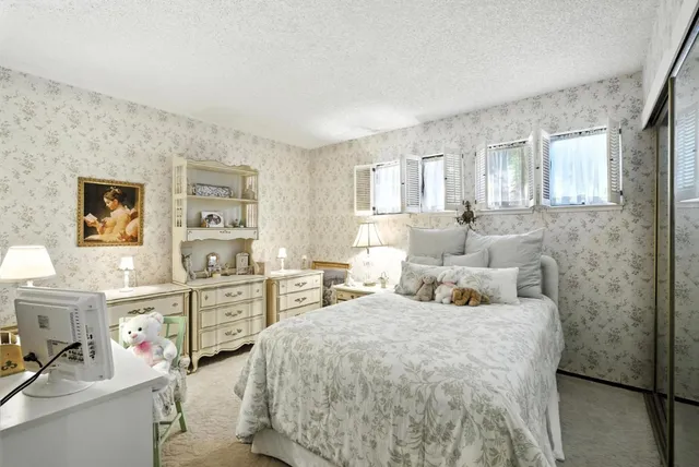 a bedroom with double bed and a window