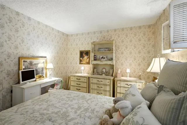 a bed room with a bed and a television