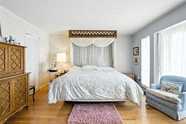 a bedroom with a bed and a couch