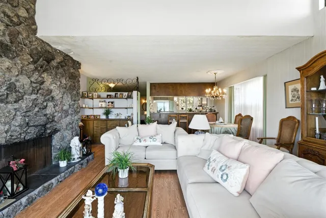 a living room with furniture fireplace and a flat screen tv