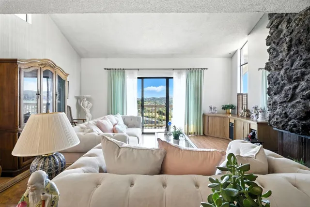 a living room with furniture and a lamp