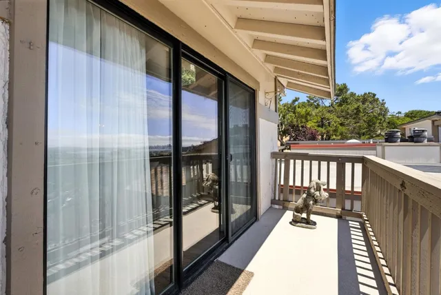a balcony with view of living room