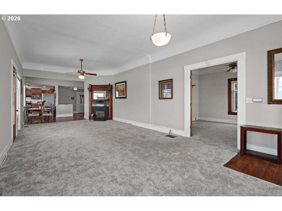 406 West C Street Rainier, OR 97048 - Photo 11 of 48 a view of a livingroom with furniture and a ceiling fan