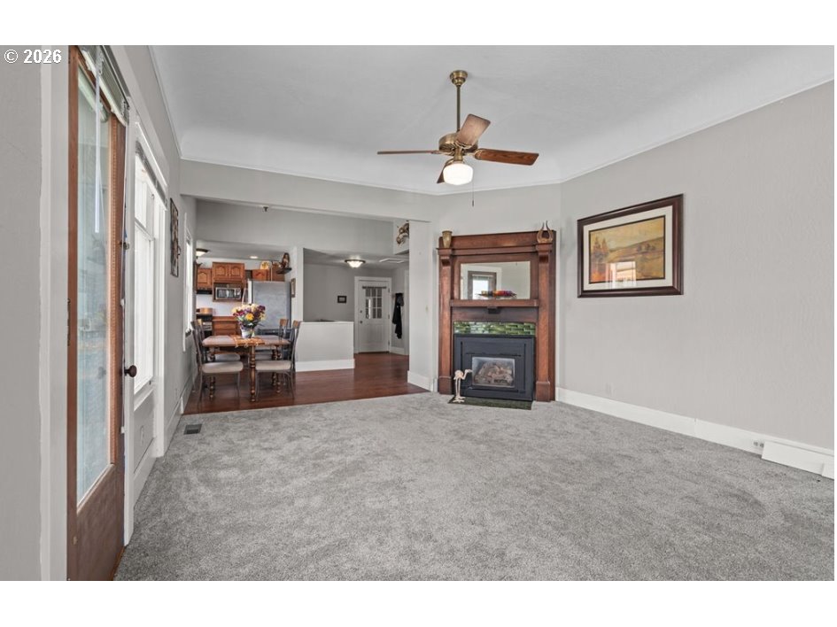 406 West C Street Rainier, OR 97048 - Photo 14 of 48 a view of a livingroom with furniture and a flat screen tv