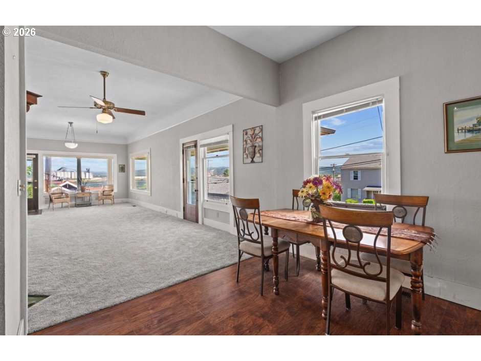 406 West C Street Rainier, OR 97048 - Photo 17 of 48 a view of a dining room with furniture and a livingroom